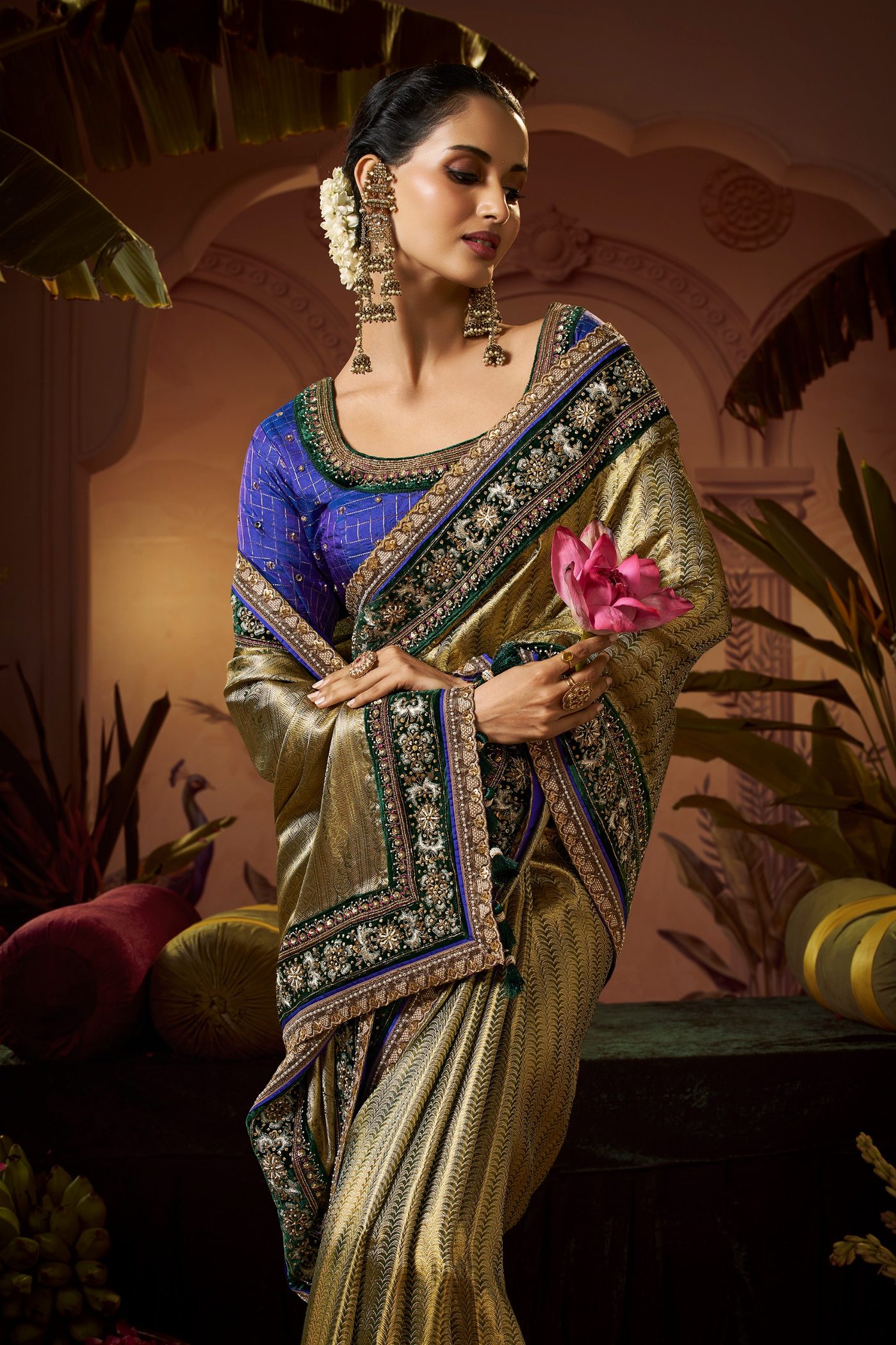 Olive gold tissue Kanjivaram saree styled with a royal blue hand embroidered blouse